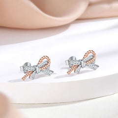 Rosévergoldetes Pavé-Schmuckset aus Sterlingsilber mit Zirkonia und gedrehter Schleife