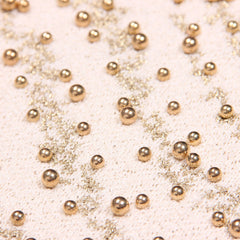 Top corto de punto con cuello redondo, rayas Charon de dos tonos y lúrex brillante, detalle de cuentas