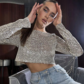 Top corto de lentejuelas semitransparentes con cuello redondo y manga larga con efecto metálico brillante