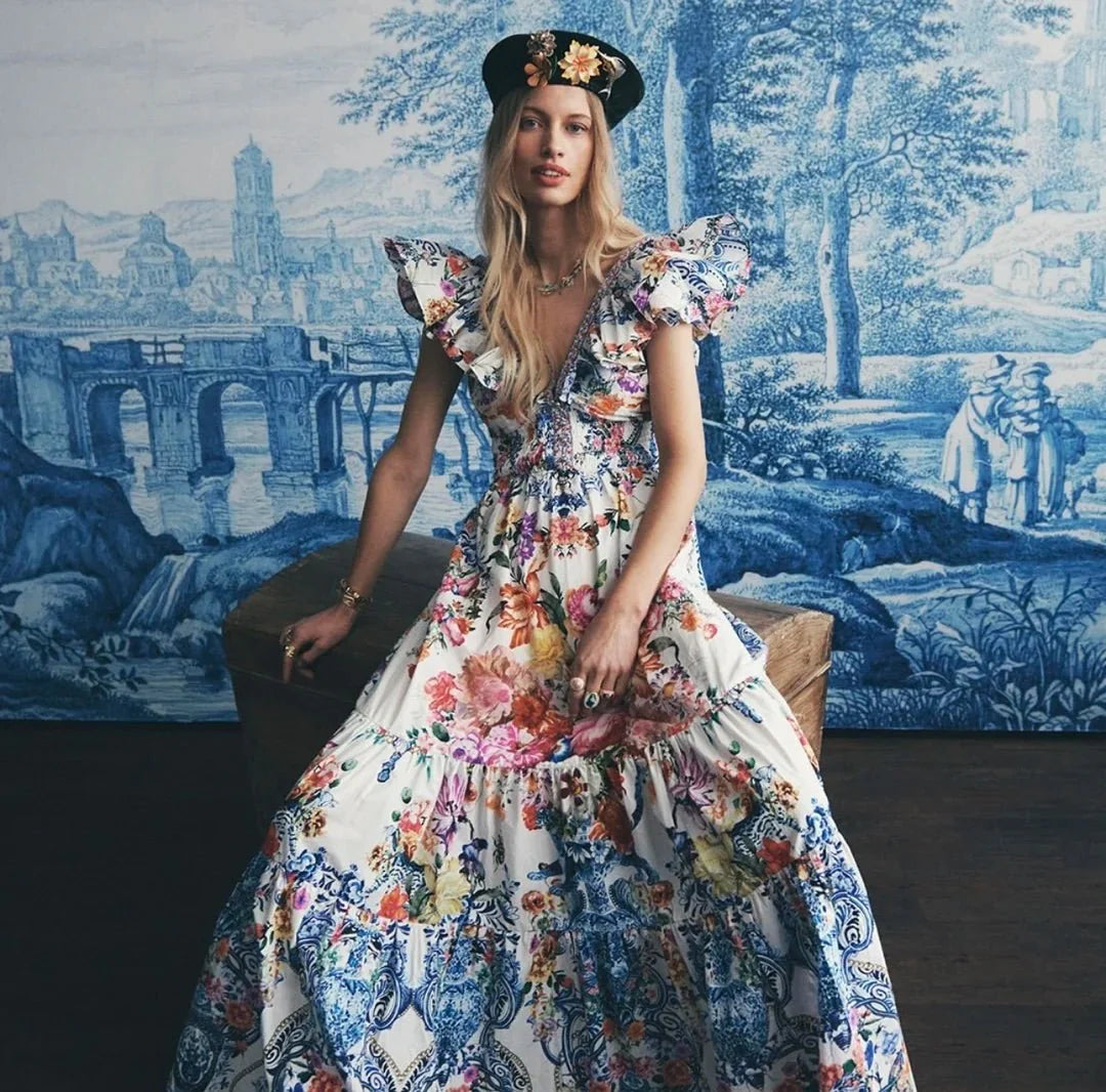 Vestido largo con vuelo y cuentas florales