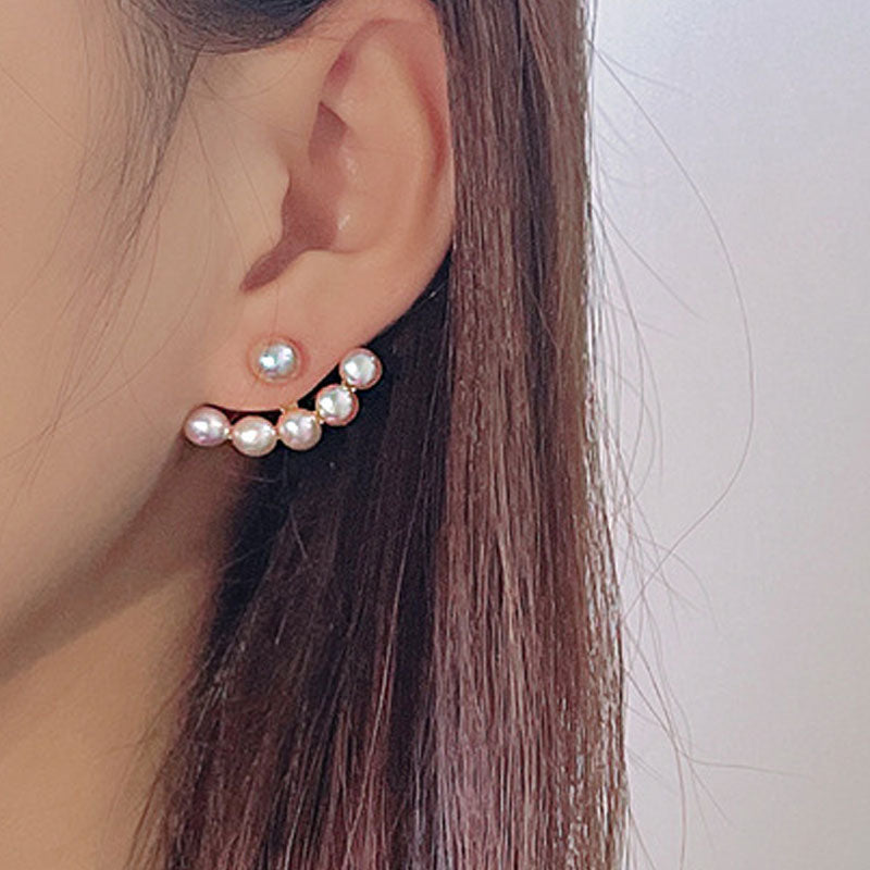 Aretes tipo chaqueta con forma de sonrisa y perla de agua dulce lustre bañados en oro de 18 quilates