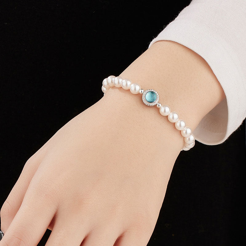 Pulsera con dije de perla de agua dulce, circonita cúbica y cristal de aguamarina