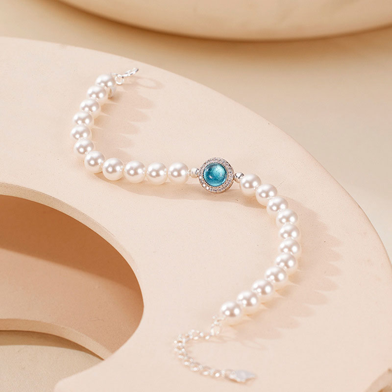 Pulsera con dije de perla de agua dulce, circonita cúbica y cristal de aguamarina