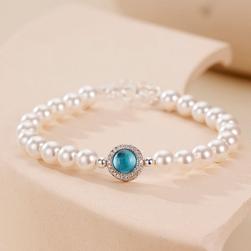 Pulsera con dije de perla de agua dulce, circonita cúbica y cristal de aguamarina