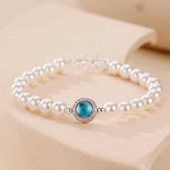 Pulsera con dije de perla de agua dulce, circonita cúbica y cristal de aguamarina