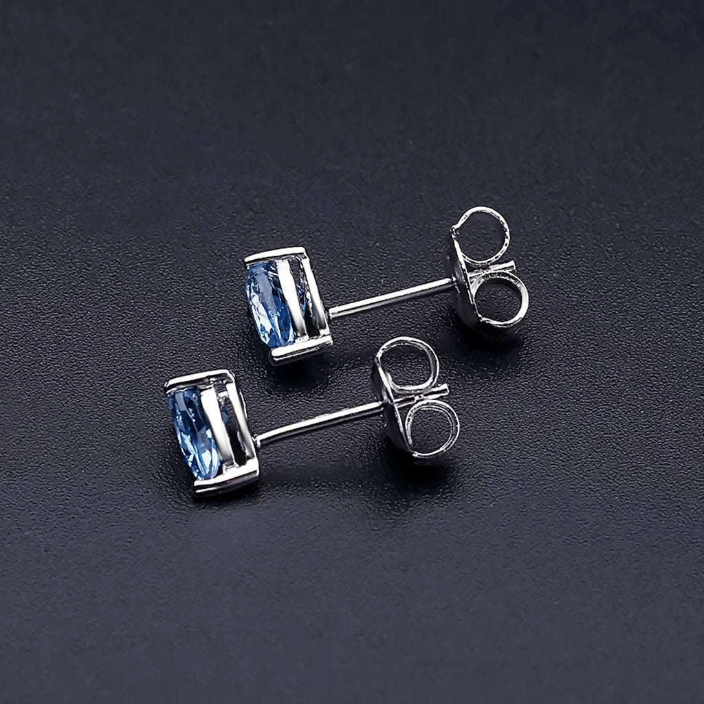 Opulent Pear Shaped Halo Swiss Blue Topaz Stud Earrings